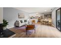 Bright open-concept living space with modern finishes, including a cozy fireplace and updated flooring at 213 Summerwalk Cir, Chapel Hill, NC 27517