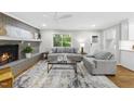 Cozy living room features a brick fireplace and neutral decor at 215 Westridge Dr, Raleigh, NC 27609