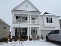 Charming two-story home with a covered porch and well-maintained lawn at 222 Oak Branch Trl, Garner, NC 27529