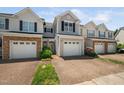 Lovely townhome featuring a one-car garage, landscaped front yard, stone accents and a cozy, inviting entrance at 2609 Asher View Ct, Raleigh, NC 27606