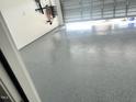 Spacious garage with epoxy floor finish, ideal for car care or hobby projects at 267 Darecrest Ln, Wendell, NC 27591