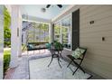Cozy porch featuring a swing, a small table, and a chair, creating a welcoming outdoor space at 30150 Walser, Chapel Hill, NC 27517