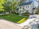 Charming two-story home with manicured lawn, beautiful landscaping, and a spacious driveway at 3204 Terrel Mill Rd, Raleigh, NC 27616