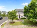 Attractive townhome with manicured lawn, mature trees, and a welcoming front porch at 3508 Oneonta Ave, Raleigh, NC 27604