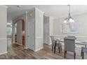 Elegant dining room with hardwood floors, a chandelier, and a table set for a cozy meal at 4535 Sugarbend Way, Raleigh, NC 27606