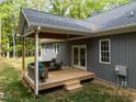Cozy wooden deck with comfortable seating, offering a relaxing outdoor space at 5402 Shealtiel Way, Rougemont, NC 27572