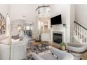 Spacious living room with fireplace, hardwood floors, and an open floor plan at 5504 Creekdale Cir, Raleigh, NC 27612