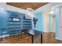 Bright dining area with modern lighting, shelving, and hardwood floors at 618 N Boylan Ave # 622, Raleigh, NC 27603