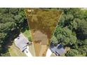 Aerial view of home on .63 acre lot featuring mature trees and landscaping at 624 Moultonboro Ave, Wake Forest, NC 27587