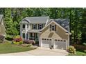 Well-maintained two-story home with attached garage and manicured lawn at 624 Moultonboro Ave, Wake Forest, NC 27587