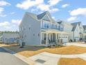 Charming two-story home with a welcoming front porch and well-maintained landscaping at 6633 Penfield St, Wake Forest, NC 27587