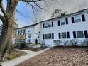 Charming multi-Gathering home featuring a well-maintained yard and inviting entryway, with a classic brick facade at 707 Wade Ave, Raleigh, NC 27605