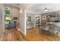 Open-concept living space featuring hardwood floors and a view of the dining area at 7508 Venture Ct, Raleigh, NC 27615