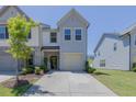 Charming townhome with a one-car garage, welcoming front entrance, and well-maintained landscaping, perfect for comfortable living at 79 Hawkstone Dr, Clayton, NC 27527