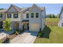 An angled view shows the home's manicured lawn, attached garage, and desirable location in a neighborhood at 79 Hawkstone Dr, Clayton, NC 27527