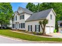 Traditional two-story house with a two-car garage and well-kept landscaping in a suburban setting at 8600 Clivedon Dr, Raleigh, NC 27615