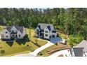A luxurious home in a serene neighborhood, featuring a long driveway and well-maintained lawns at 904 Harrison Ridge Rd, Wake Forest, NC 27587