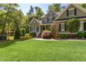 Charming two-story home with manicured lawn and mature trees at 945 Jones Wynd, Wake Forest, NC 27587