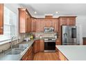 Well-equipped kitchen with stainless steel appliances and ample countertop space at 1006 Trumpet Vine Ct, Wendell, NC 27591