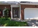 Close-up of the front entrance showing brick facade and address number at 10461 Dapping Dr, Raleigh, NC 27614