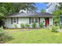 Inviting single-story home with a well-maintained lawn and charming curb appeal at 106 Eugene St, Carrboro, NC 27510