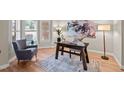 Bright office space with hardwood floors, natural light from the large window, and stylish decor at 12508 Angel Falls Rd, Raleigh, NC 27614