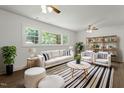 Bright living room with hardwood floors, large windows and comfortable furniture at 1314 Hudson Ave, Durham, NC 27705