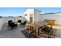 This patio area includes a table with seating, chairs, and a storage cabinet, perfect for outdoor entertaining at 138 North White St # 200, Wake Forest, NC 27587