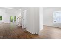 Spacious living room featuring wood floors, white walls, and bright natural light at 1408 South St, Durham, NC 27707