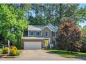 Charming brick home with a yellow front door and well-maintained landscaping at 2018 Waterton Ln, Apex, NC 27502