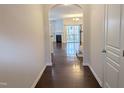 Inviting foyer with hardwood floors leads to an open-concept living area with plenty of natural light at 204 Stockton Gorge Rd. Rd, Morrisville, NC 27560