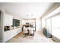 Bright kitchen featuring a large island, stainless steel appliances, and ample cabinet space at 2711 Laurelcherry St, Raleigh, NC 27612