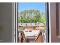 View of the complex's parking lot from inside the front door at 294 Summerwalk Cir, Chapel Hill, NC 27517