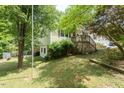 Two story single Gathering home with fenced in yard and deck at 306 N Sixth St, Mebane, NC 27302