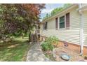 Inviting home exterior with a walkway leading to the front door at 306 N Sixth St, Mebane, NC 27302