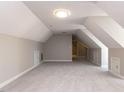 Large bonus room with neutral carpet and plenty of space at 312 Heidinger Dr, Cary, NC 27511