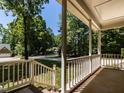 View from the porch showcasing the manicured lawn and neighborhood trees at 312 Heidinger Dr, Cary, NC 27511