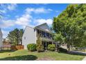 Charming two-story home with manicured landscaping, a combination brick and siding exterior, and a welcoming front porch at 3801 Althorp Dr, Raleigh, NC 27616