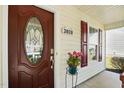 Close-up of front door with decorative glass, house number, and red shutters at 3808 Hopper St, Raleigh, NC 27616