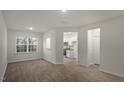 Spacious living room boasts hardwood floors and ample natural light from a large window at 412 Ember St, Sanford, NC 27330