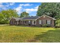 Traditional brick home with shutters and manicured landscaping at 4314 Hopkins Rd, Middlesex, NC 27557