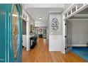 Elegant foyer with hardwood floors and detailed trim, showcasing a bright and welcoming entrance at 5117 Dove Forest Ln, Apex, NC 27539