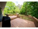 Spacious wooden deck perfect for outdoor dining and relaxation, overlooking a lush backyard at 529 Orindo Dr, Durham, NC 27713
