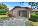 Attached brick carport with a covered side walkway and well-maintained landscaping at 620 Mcghees Mill Rd, Roxboro, NC 27574