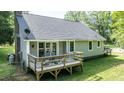 Home's lovely backyard deck, accessible through glass doors, offers a perfect spot for outdoor enjoyment at 726 Thomas Rd, Rocky Mount, NC 27801
