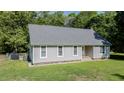 Ranch home with a new gray roof, fresh paint, and a meticulously maintained lawn at 726 Thomas Rd, Rocky Mount, NC 27801