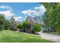 Beautiful home with a well-maintained lawn and an inviting driveway at 1 Plowlan Ct, Durham, NC 27707