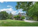 Beautiful home with a well-maintained lawn and an inviting driveway at 1 Plowlan Ct, Durham, NC 27707