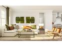 A cozy living space with large windows, stylish furnishings, and bright, natural light at 104 Corapeake Way, Apex, NC 27539
