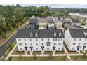 An aerial view of the neighborhood with various house colors and community landscaping at 104 Vallco Ln, Durham, NC 27713